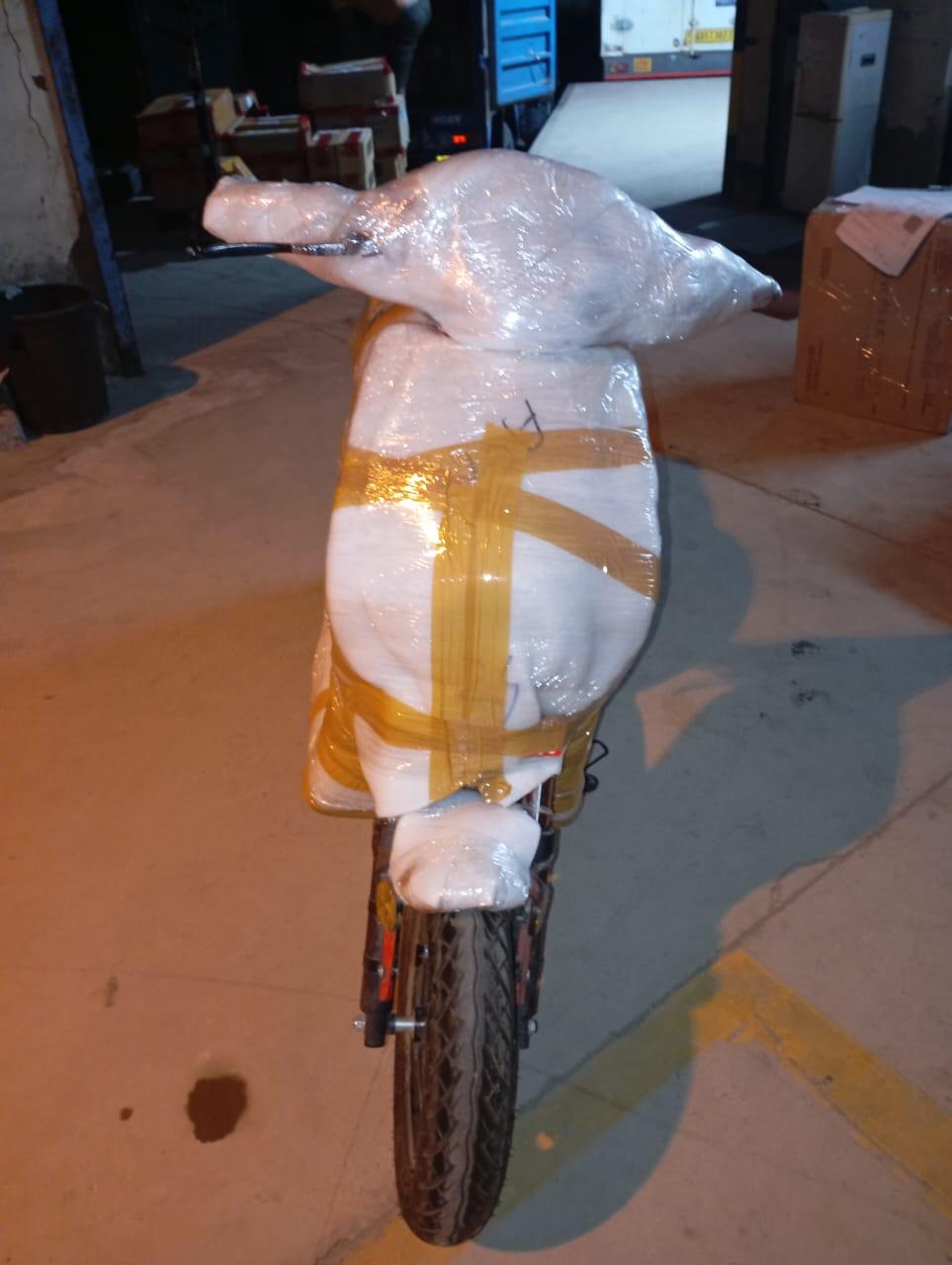 Wrapped scooter loaded on a transport truck ready for long-distance delivery